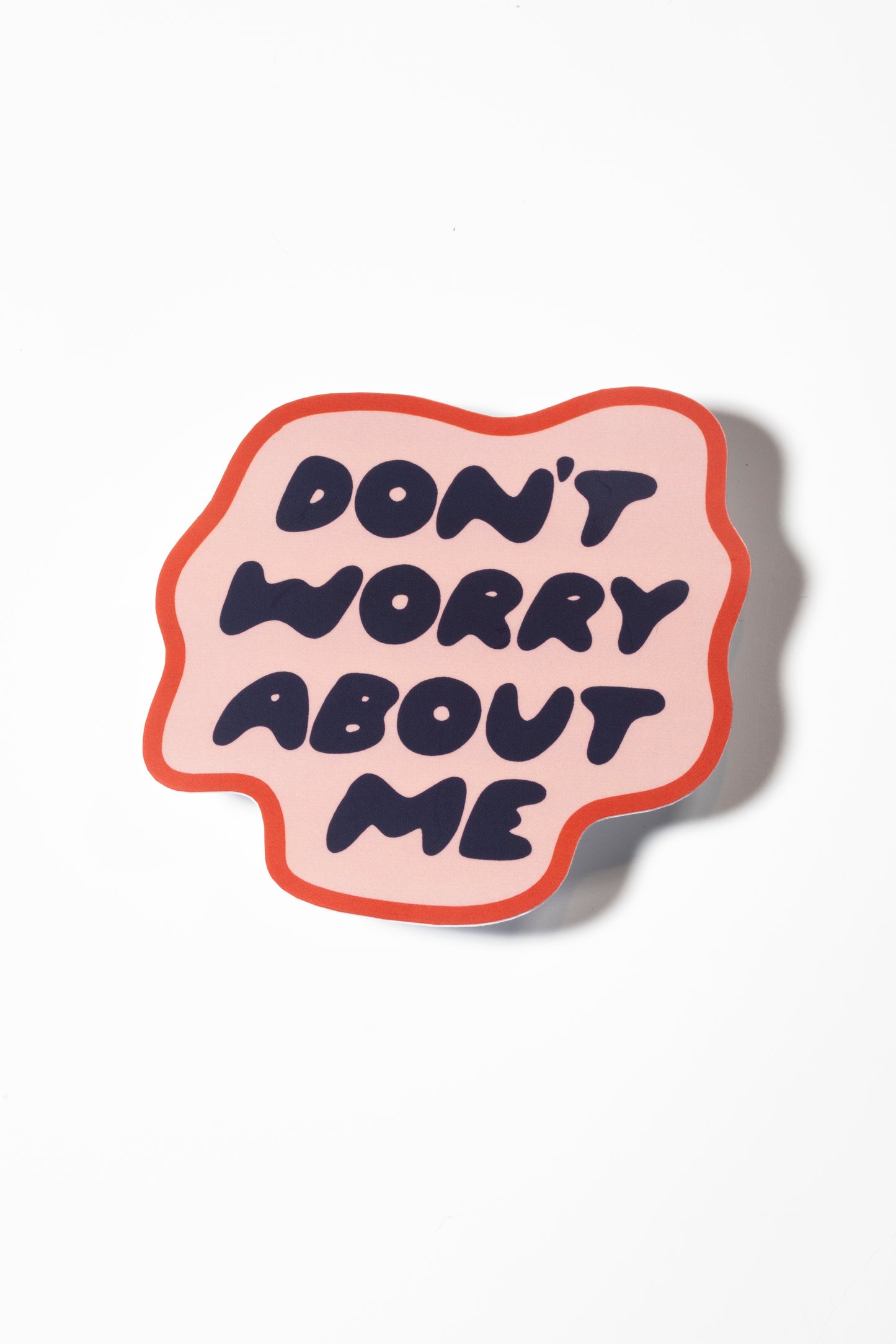 Sticker that reads "don't worry about me" sticker on a white background.