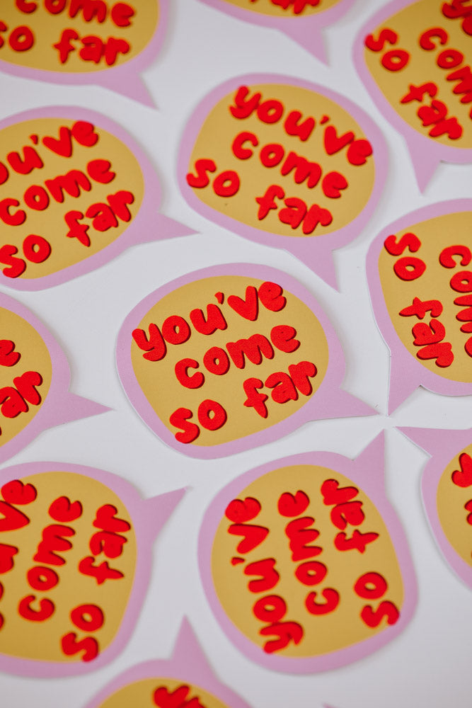 Multiple speech bubble stickers arranged in a pattern on a white background. Each sticker features the same design: a pink-bordered speech bubble with a yellow background and red bubble letters reading 'you've come so far'