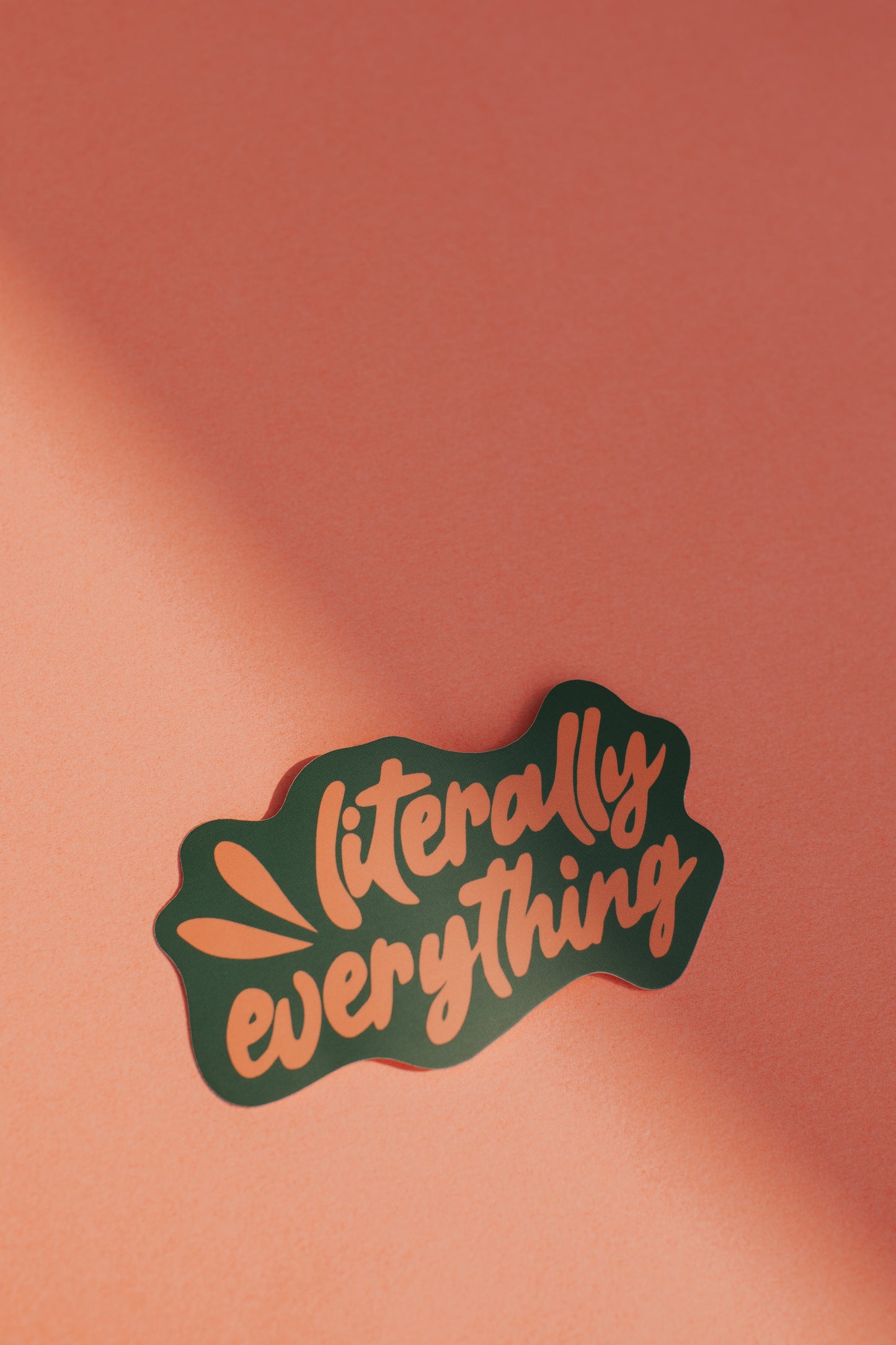 A bright orange background with the text "Literally everything" written in a bold, stylized font.