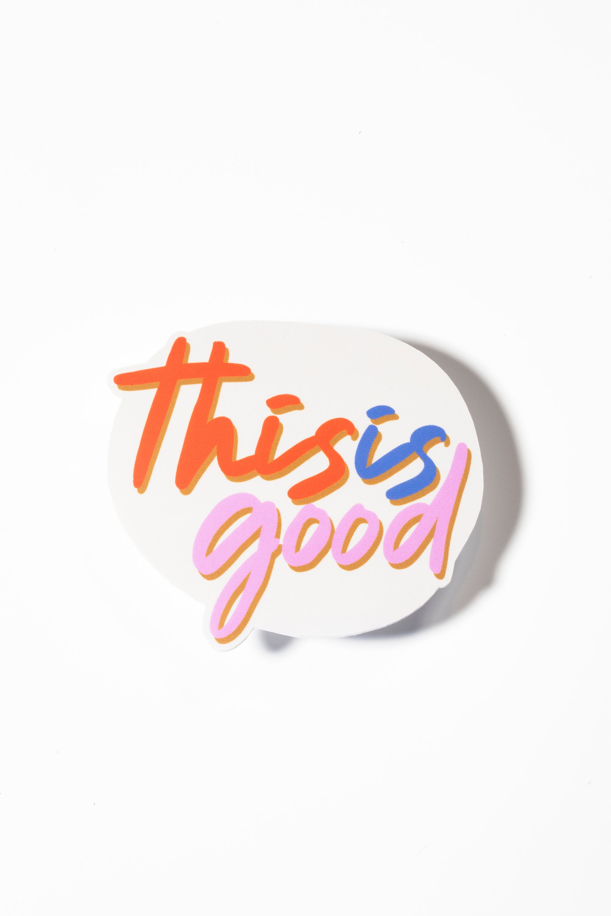 Sticker on white that reads "This is Good" in red, blue and pink cursive font.